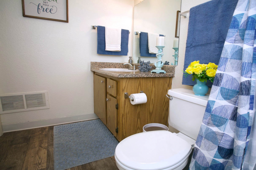 This Bedroom and bathroom 7 photo can be viewed in person at the Walnut Village Apartments, so make a reservation and stop in today.